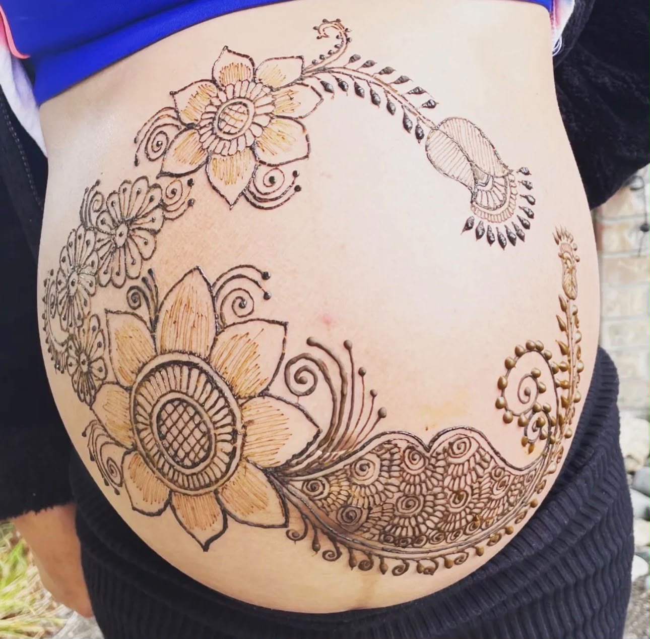 Belly henna design for maternity photo shoot